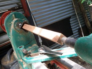 square stock mounted between centres in a wood lathe